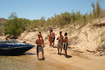 The guys hanging on the beach.