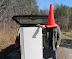 This picture makes no sense - Guy - finger - freezer - car - road and stolen inventory. Is there a point?