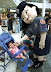 Insane police doll from Japan - Hey - weirdo - stop scaring kids in supermarket!