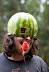 A man in the watermelon mask - I bet even he doesn't know why he's doing this.