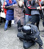 Miserable failure - Russian police officer beaten by an old lady.