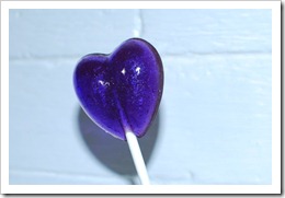photo of honey-jasmine flavored purple lollipop, taken with flash