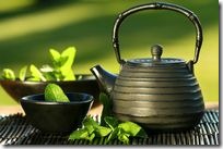 Black asian teapot with mint tea Black asian teapot with mint tea