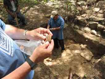 Archaeologist George Bey of Millsaps College looks at pottery fragments interred in the floor of a home at Kiuic, a Mayan practice when building new structures.  Archaeologist George Bey of Millsaps College looks at pottery fragments interred in the floor of a home at Kiuic, a Mayan practice when building new structures.