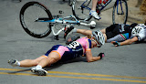 Lauren Hall (#206) of Team Vera Bradley Foundation and Rushlee Buchanan (#248) of Colavita/Baci Pro Cycling Team crash May 9, 2010, during the Sunday Criterium of the Joe Martin Stage Race in Fayetteville, Arkansas.