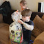 Jakob opening his Easter basket from Grandpa, Grandma & Tanya