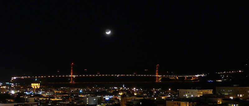 the moon is hanging on top of the bridge the moon is hanging on top of the bridge