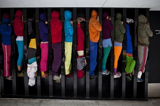 Performers situate themselves into position during a piece entitled "Bodies in Urban Spaces" by choreographer Willi Dorner.  Starting at sunrise, the performers inched their way into different spaces throughout lower Manhattan.<br /><br />CREDIT: Bryan Derballa for The Wall Street Journal<br />NYBODIES
