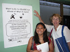 Program Manager Alana Okamoto and ISA liason Barb Rand pose near one of our beautiful fliers!