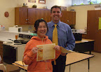 “I did it!” Queenie Yu smiles proudly with Board Member Fred Mendez