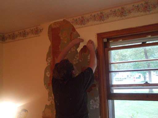 Stripping wallpaper in master Stripping wallpaper in master