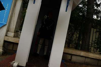 The guards wear funny clothes. This dude is outside the palace.