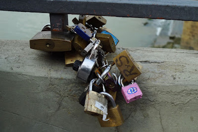 Neat little tradition! Lock it up and throw the key away, keeping your love eternal.
