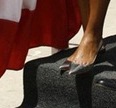 [hokey pokey-First lady Michelle Obama is escorted off the ceremonial plank by Northrop Grumman President Mike Petters[4][4].jpg]