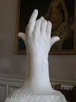 In the Rodin museum, this piece is called The Secret. It's an amazing study of hand anatomy.