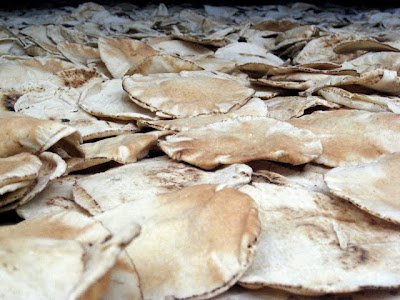 Pita bread on the floor of a food market in Nizwa Oman