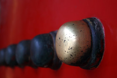 Bronze on a red door in the Forbidden City in Beijing