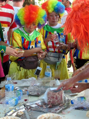 Runners dressed like clowns during the Marathon du Medoc in France