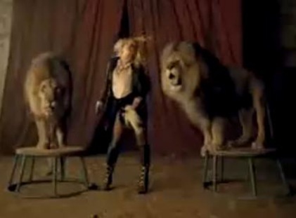 Britney Spears dancing with elephants and lions in Circus picture