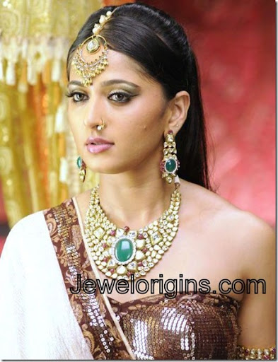 South Indian actress Anushka with designer gold and diamond necklace paired