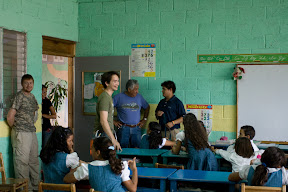 Chris, James and Modesto in a classroom.