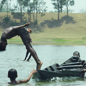 Rejoicing Drive by Rupam Chakraborty - Babies & Children Children Candids ( water, season, street, children, candid, people )