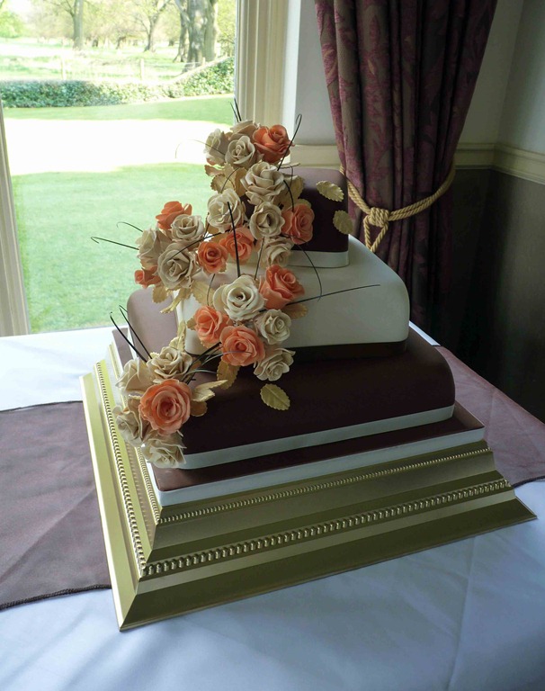[3-tier-Rose-with-chcolate-and-ivory-layers-wedding-cake-at-dunkenhalgh[4].jpg]