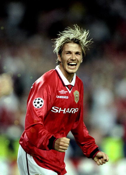 26 May 1999:  David Beckham of Manchester United celebrates victory over Bayern Munich in the UEFA Champions League Final at the Nou Camp in Barcelona, Spain. United scored twice in injury time to win 2-1.  Mandatory Credit: Ben Radford /Allsport