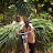 Two youth pushing bicycle with a load of grass Two youth pushing bicycle with a load of grass