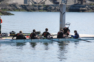 men's novice 4+ boat gets final instructions from coach 