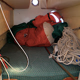The other stern berth with sails and cockpit canopy.
