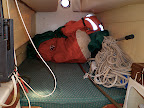 The other stern berth with sails and cockpit canopy.
