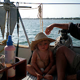Emma James being sun safety conscious with Daddy's hat.