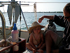Emma James being sun safety conscious with Daddy's hat.