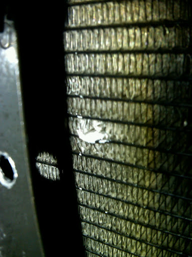 hole%20in%20condenser%202.jpg