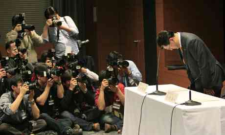 Toyota Motor Corp President Akio Toyoda bows at the begin of a headlines discussion in Nagoya