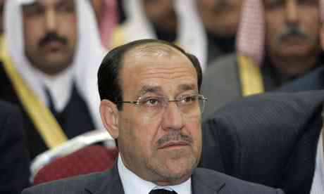 Iraqi budding apportion Nouri al-Maliki at an choosing rally.