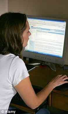 Young brunette lady checks her email 