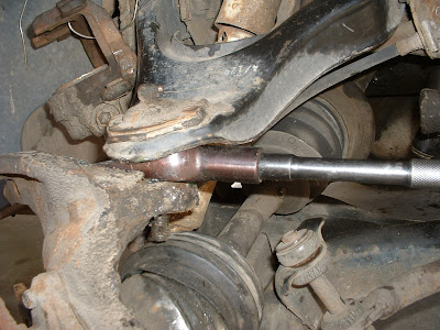 Now more of this fun stuff.  I finally got me a BFH and hammered apart the upper ball joint using the same pickle fork I used for the tie rod ends.  MUCH quicker with a BFH!