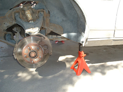 Jacked up the front of the car and removed the front wheels (realizing how much my cheap ass impact wrench sucks).