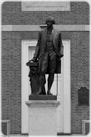 Washington Statue: He looks resolutely onward, on a pedestal bearing his name, in front of the building where the Declaration of Independance was adopted and signed. (1/640 sec @ f/1.8; 50mm) Copyright 2009, Kerri Shotts