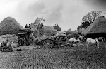 Threshing in 1935. Fred Jones and Ted Keep standing under machine. In field now part of Upton Fruit Farm. From Mrs Keep's album.