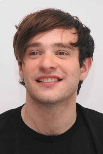 Side swept bangs hairstyle from Charlie Cox