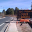 new construction sign that was moved off the road apparently after someone ran their car into it.