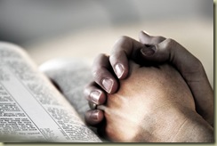 fotolia-praying-hands-on-bible1