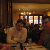 Nick is trying to get a picture of the Chris Rose that you can barely see between Tim and Bree...