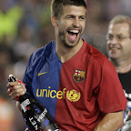 Barcelona's Gerard Pique from Spain celebrates his team's victory in the Spanish league title 2009 and the Spanish King's cup 2009 after the Liga football match against Osasuna at the Camp Nou Stadium in Barcelona, on May 23, 2009. AFP PHOTO / JOSEP LAGO