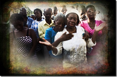 People attend Sunday catholic mass outside the destroyed National Cathedral in Port-au-Prince, 5 days after a powerful earthquake measuring 7.0 on the Richter Scale devastated the city.