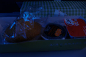 Breakfast - muffin, orange juice, and yogurt