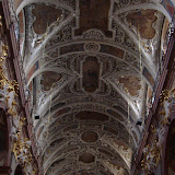 High ceilings.  Baroque-style ornaments.  Scaffolding.
